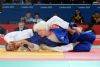 Marta Arce,  luchando contra la judoka finlandesa Paivi Tolppanen