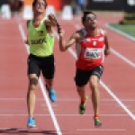 Xavier Porras y su guía, Enric Martín Panadés, en los 100 metros (clase T11) del Mundial de Lyon 2013.