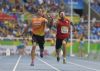 Xavier Porras, junto a su atleta de apoyo Enric Martn, en las rondas eliminatorias de los 100 metros en categora T11 donde finaliz con un registro de 11.99